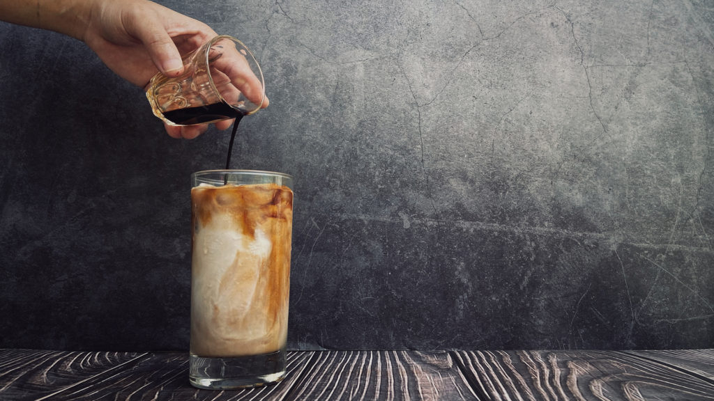 Iced coffee pouring espresso